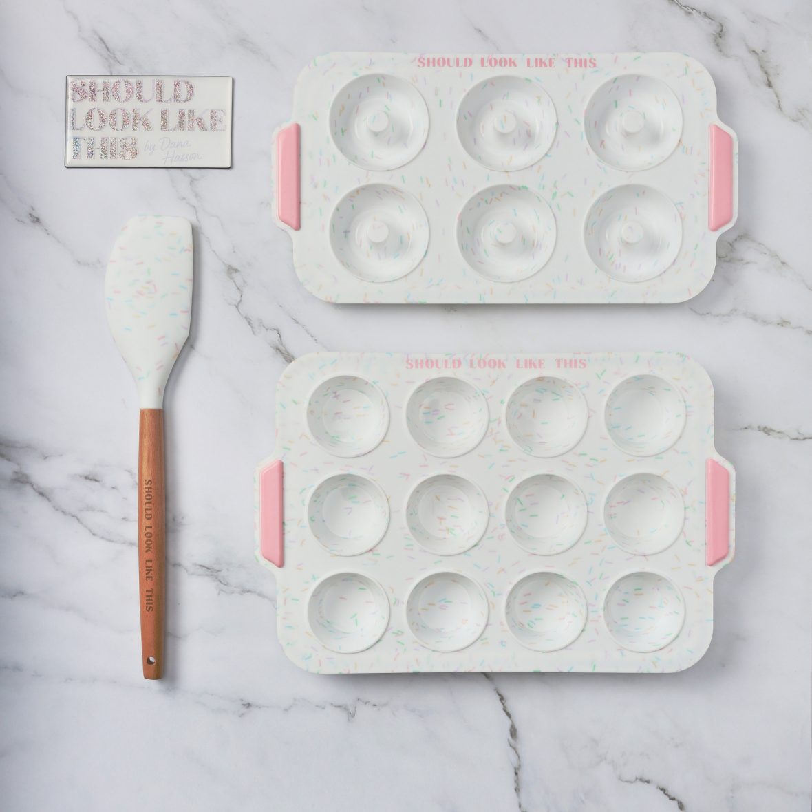 should look like this branded magnet, spatula, donut pan, mini muffin pan displayed with marble background