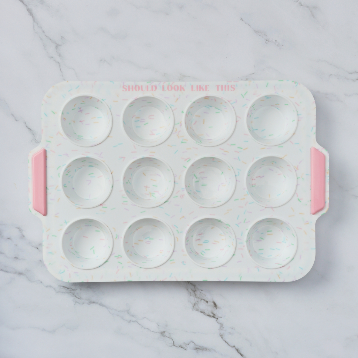 mini muffin pan with marble countertop background