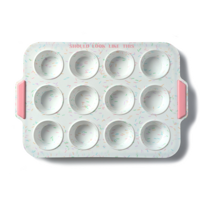 12 count mini muffin pan with white background