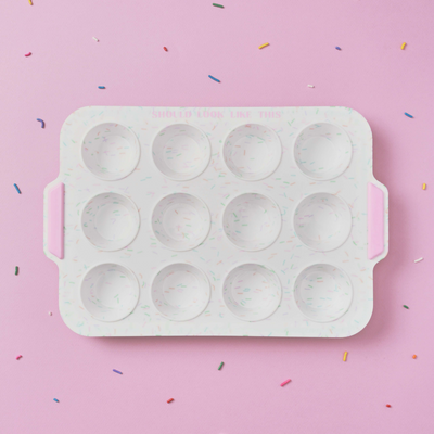 12-count mini muffin pan with confetti background